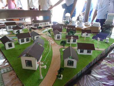 Figure 1. Model of a hybrid mini-grid used at a project presentation in a village in Myanmar (courtesy Reiner Lemoine Institut, Catherina Cader) HMG Model