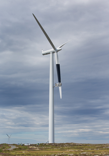 Figure 1. Painting a turbine blade in the Smøla wind farm in August 2013 by means of a platform that is lowered from the hub. Note the contrast between the painted blade and the sky (courtesy Statkraft) Engstrom figure 1