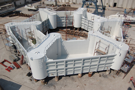 Figure 1. The counterweight nears completion, after which it will be towed out to sea, lowered to the seabed with chains attached, then filled with gravel prior to hooking up to the platform Image